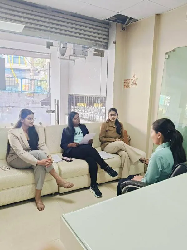 A small group talking on the office sofa