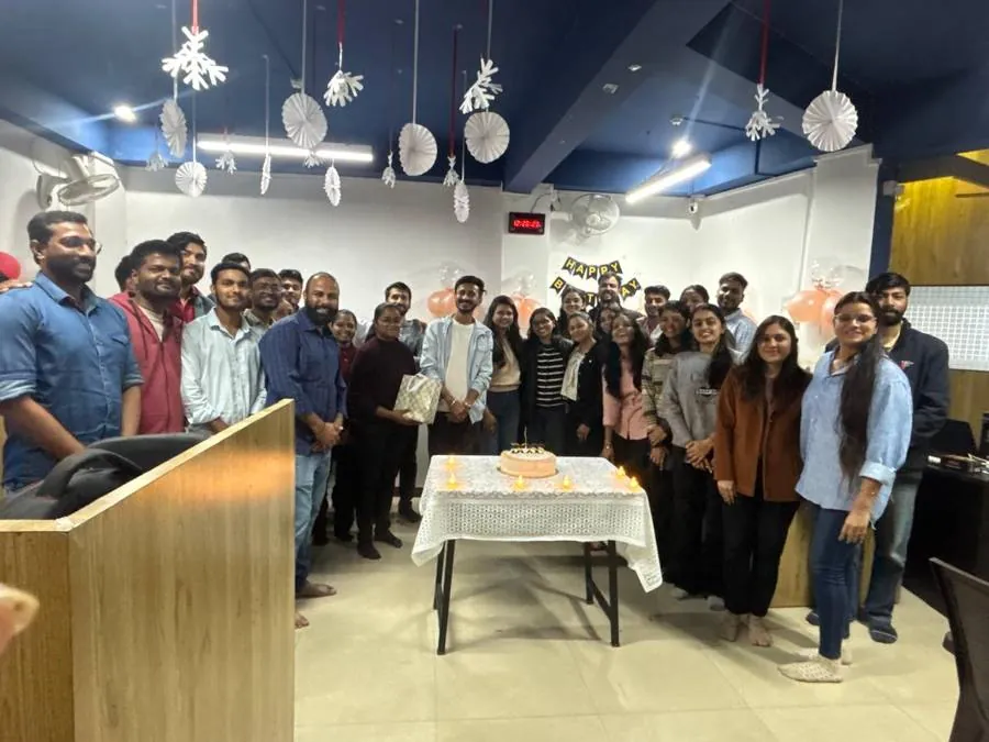 The team together in the decorated office